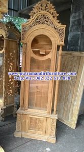 lemari jam hias masjid ukiran